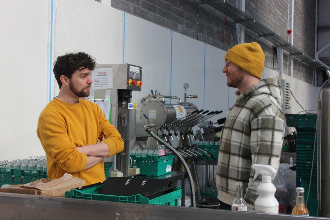 All About Kombucha's Co-Founder Keith Loftus discussing brewing strategies with Brewery Manager Harry Beresford